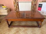 a coffee table with a glass top in a living room
