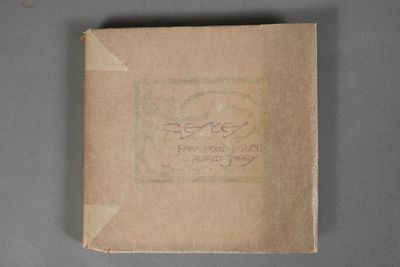a close up of a book with a brown cover on a table