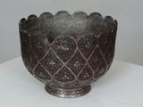 a silver bowl that is sitting on a table