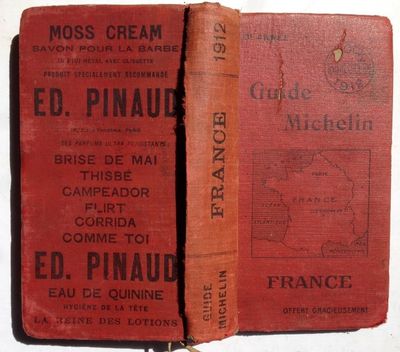 two old books that are sitting on a table