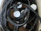a box with a bunch of black and white hoses in it