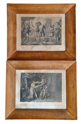 deux gravures encadrées représentant un homme et une femme, dans un cadre en bois