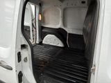 the inside of a white van with the door open
