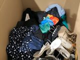 a box full of clothes and shoes in it