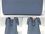 two photos of a blue purse with two handles and a chain