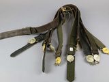 a lot of belts that are tied together on a table