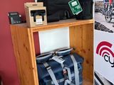 a wooden shelf with a bag and a bag on it