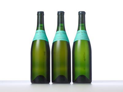 three bottles of wine sitting on top of a table next to each other