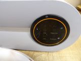 a clock that is sitting on a table next to a bowl of food