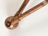 a close up of a metal pipe on a white surface