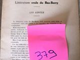 a pink post it on a book with a pink sticker on it