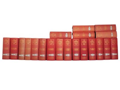 a row of red books sitting on top of each other
