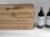 three bottles of wine sitting next to each other on a table