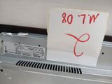 a sign that says wt08 on the side of a machine