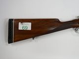 a rifle with the number 60 on the side of it