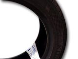 a close up of a tire with a sticker on it