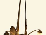 a chandelier with three lights hanging from it
