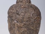 a statue of a buddha sitting on top of a table