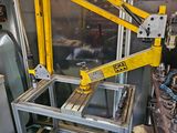 a yellow crane that is sitting in a factory