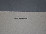 a close up of a piece of paper with the words atelie jean huguett on it
