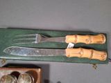 a knife, fork and spoon sitting on a table
