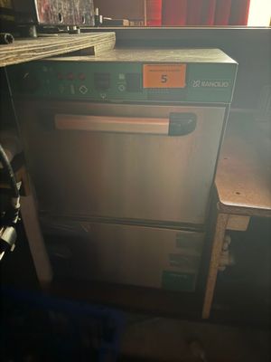 a dishwasher that is sitting in a kitchen