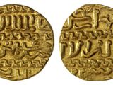 deux pièces d'or portant une écriture arabe
