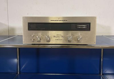 a silver radio sitting on top of a blue counter