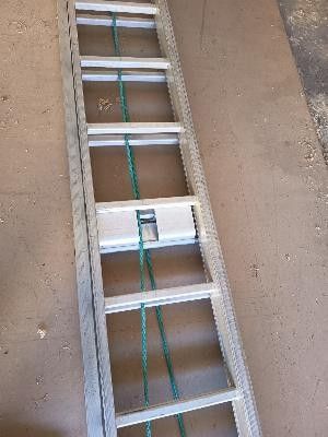 the ladder is leaning up against the wall in the garage
