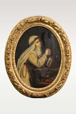 portrait of a woman in a gold frame holding a knife