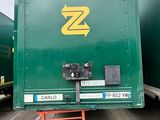 a green trailer with a yellow z logo on it