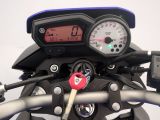 a close up of a motorcycle with a speedometer on it