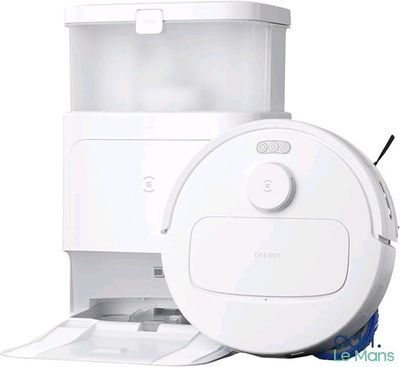 an image of a robot vacuum cleaner with a paper dispenser attached to it