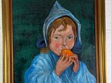 un tableau représentant un enfant en train de manger une orange, accroché au mur