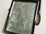 a mirror that is sitting on a table