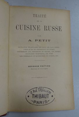 an open book with a picture of a cat sitting on top of it