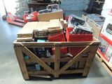 a wooden crate filled with assorted items in a warehouse