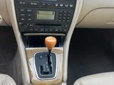 the interior of a car with a steering control and dashboard controls