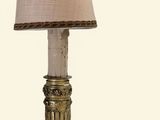 a lamp that is sitting on a table next to a lamp