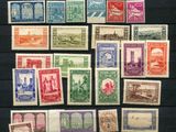 an assortment of stamps from different countries are displayed on a table