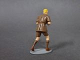 a toy figure of a man with a baseball bat