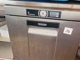 a dishwasher that is sitting on top of a counter