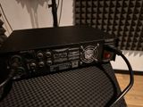 a black radio sitting on top of a black chair