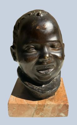 statue of a young boy with a scarf on his neck