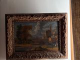 a clock on the wall next to a painting on the wall