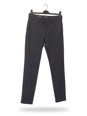 a black pants hanging on a hanger on a white background