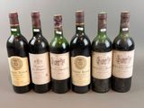 six bottles of wine are lined up in a row on a table