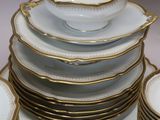 a lot of plates and bowls stacked on top of each other