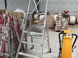 a picture of a ladder and a cart in a warehouse
