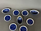 six blue and white oval magnets with a picture of a horse on them